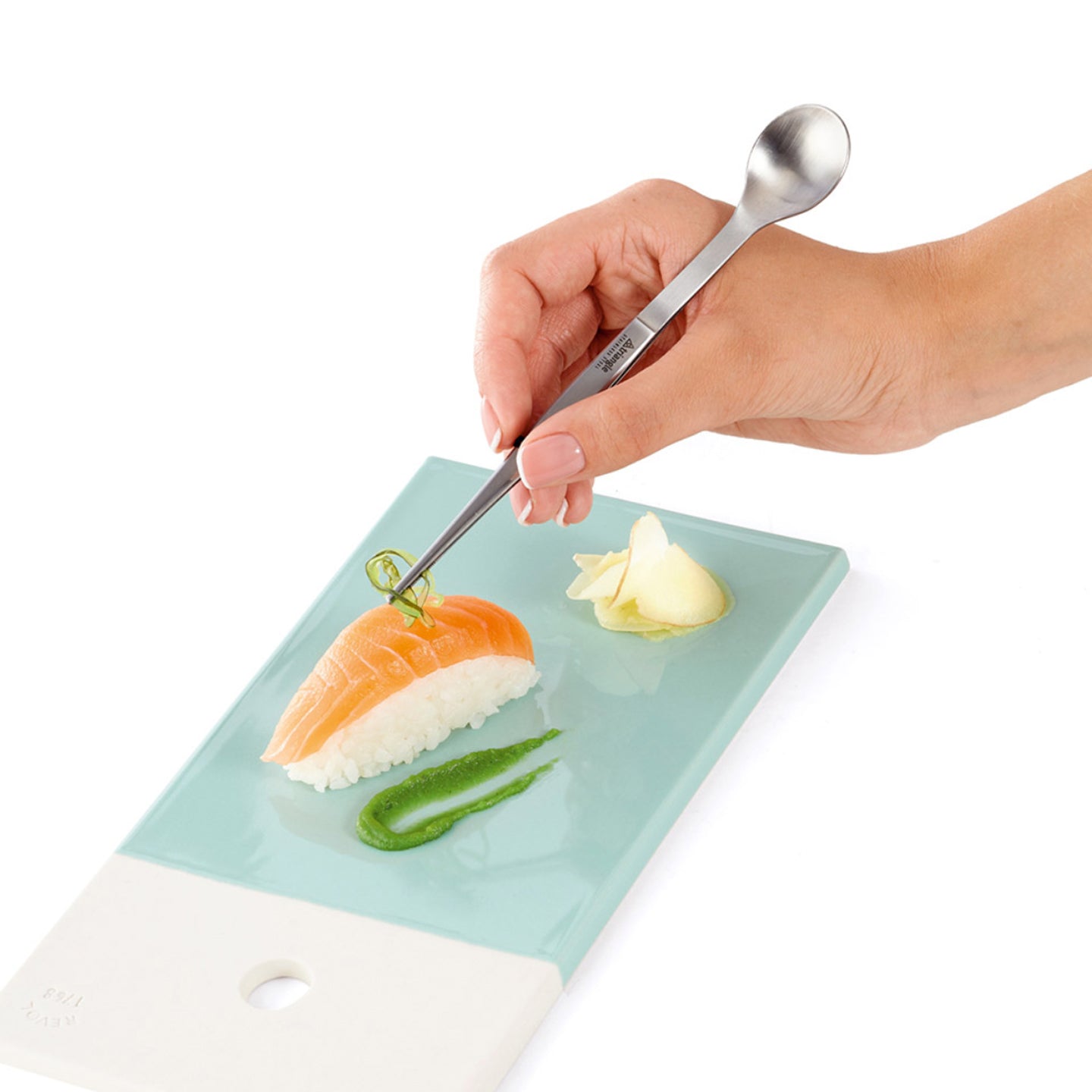 http://www.boroughkitchen.com/cdn/shop/products/triangle-chef-tasting-spoon-tweezers-in-use1-borough-kitchen.jpg?v=1612789142